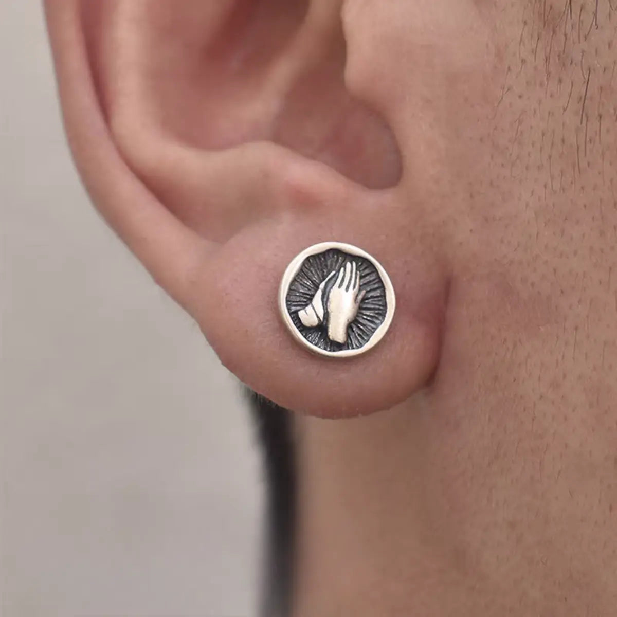 Praying Hands Earrings Silver Worn by Male Model