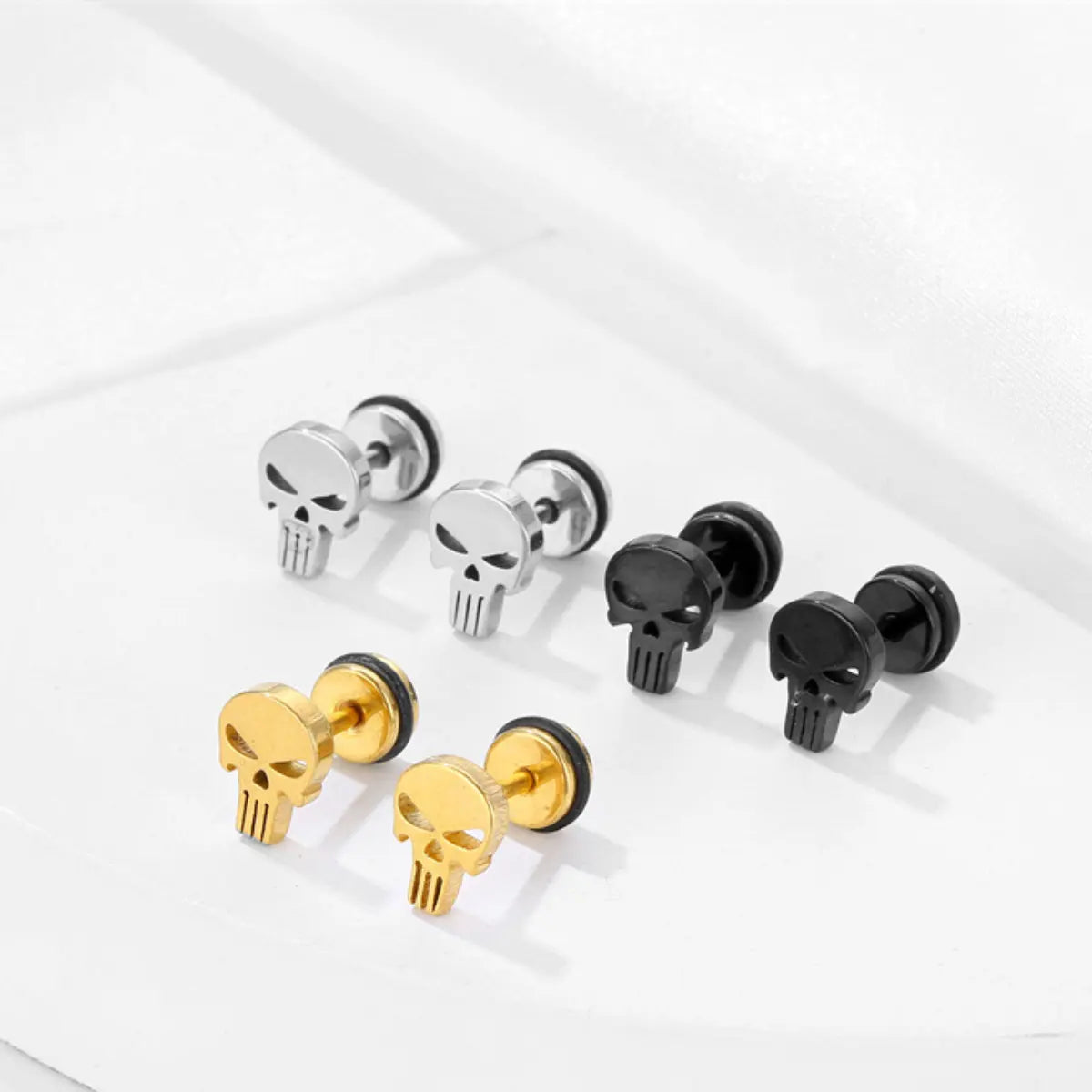 Punisher Stud Earrings Gold Silver and Black Details