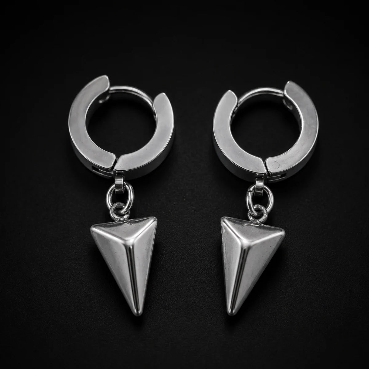 Pyramid Drop Hoop Earrings Close Up Black Background