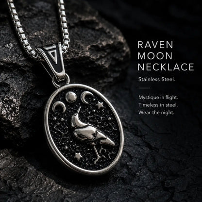 Raven Moon Pendant Necklace Silver Displayed on Stone Surface