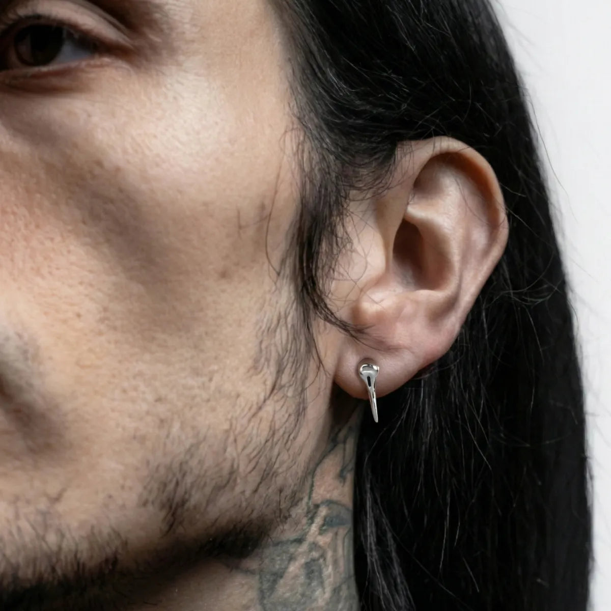 Raven Skull Stud Earrings Worn by Male Model