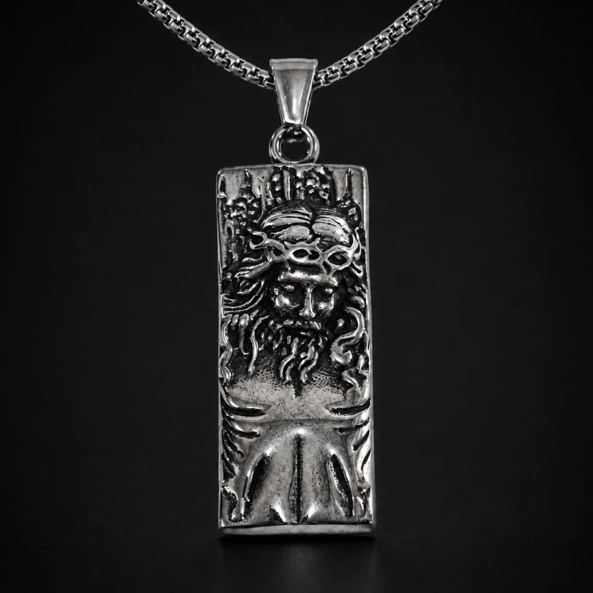 Rectangular Jesus Pendant with Crown of Thorns Silver Close Up Black Background