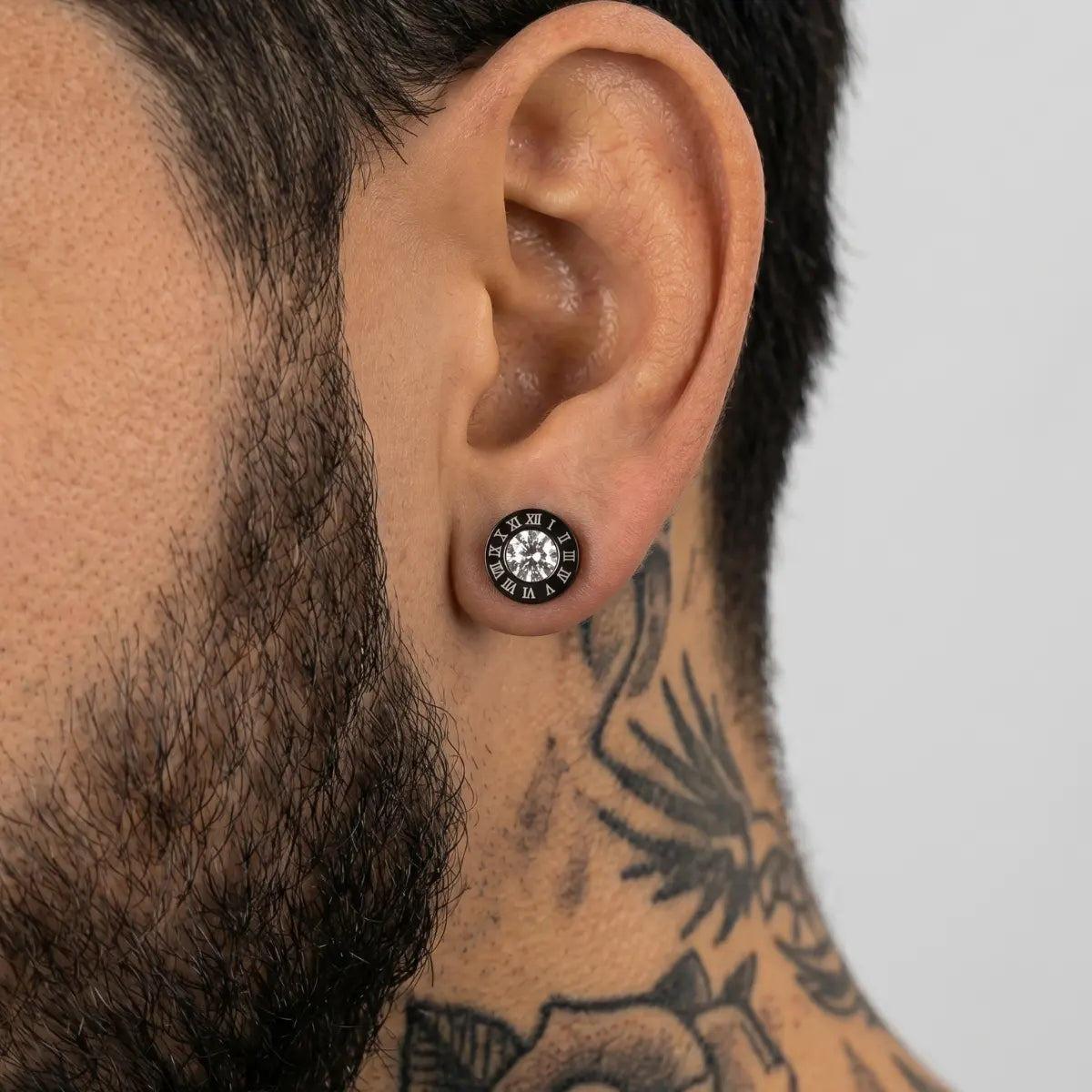 Roman Numeral Black Barbell Stud Earrings with Clear Crystal Worn by Male Model Close Up Side View