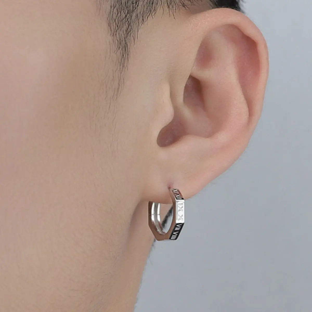 Roman Numeral Stud Earrings Worn by Male Model Close Up