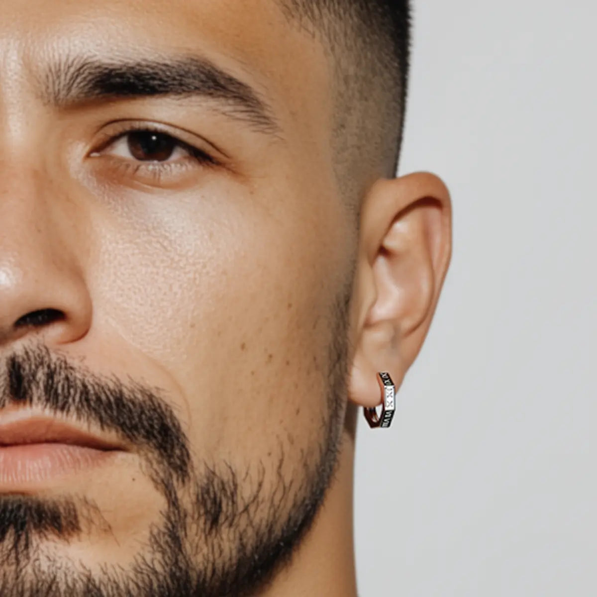 Roman Numeral Stud Earrings Worn by Male Model