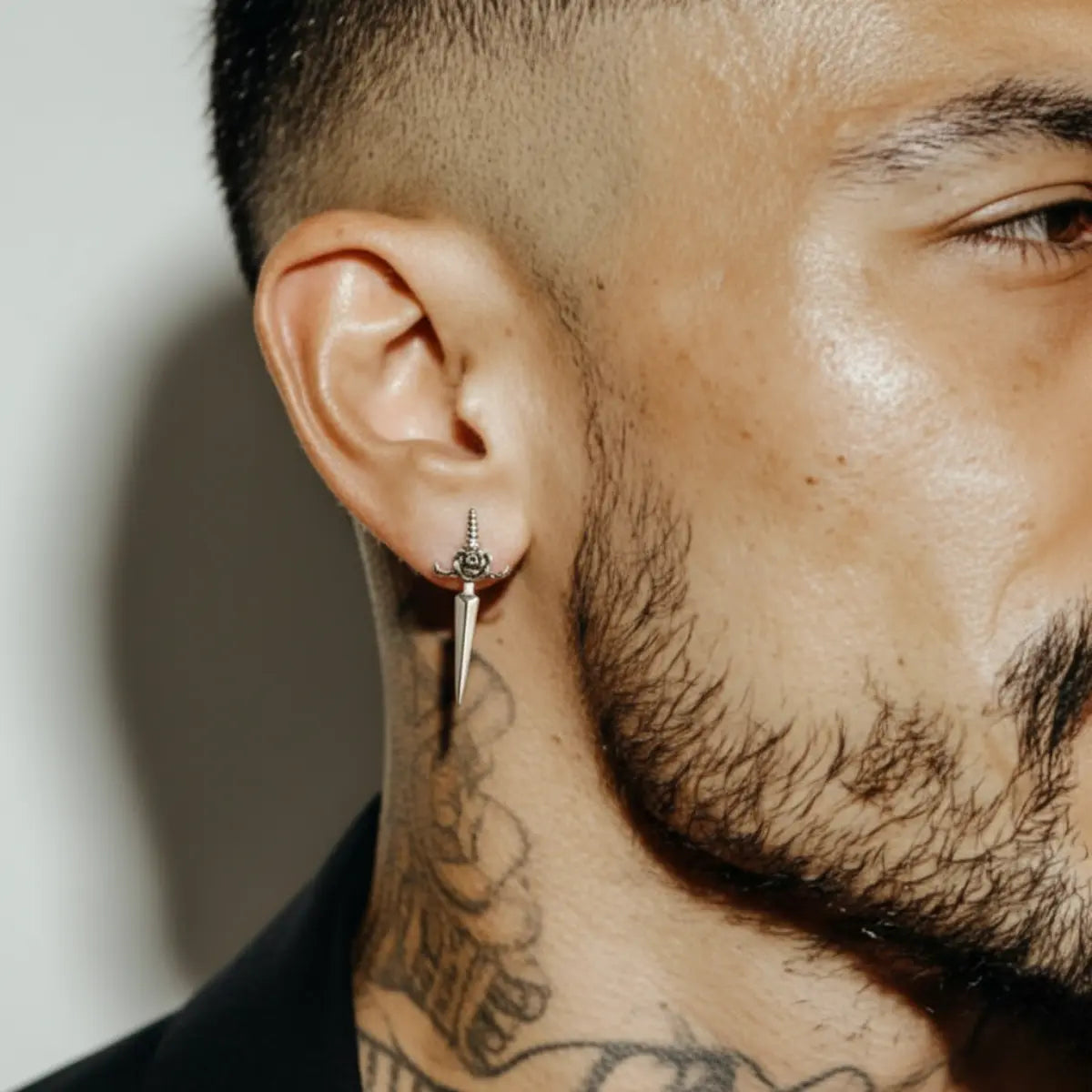 Rose Dagger Stud Earrings Worn by Male Model
