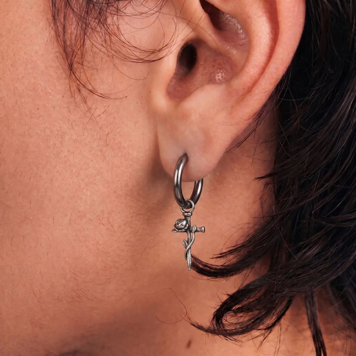 Rose Sword Drop Hoop Earrings Silver Worn by Male Model Close Up