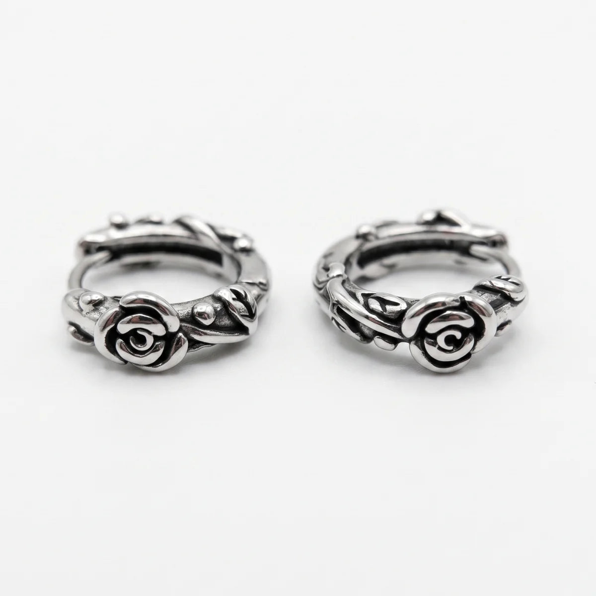 Rose Vine Hoop Earrings Silver Lying Down White Background