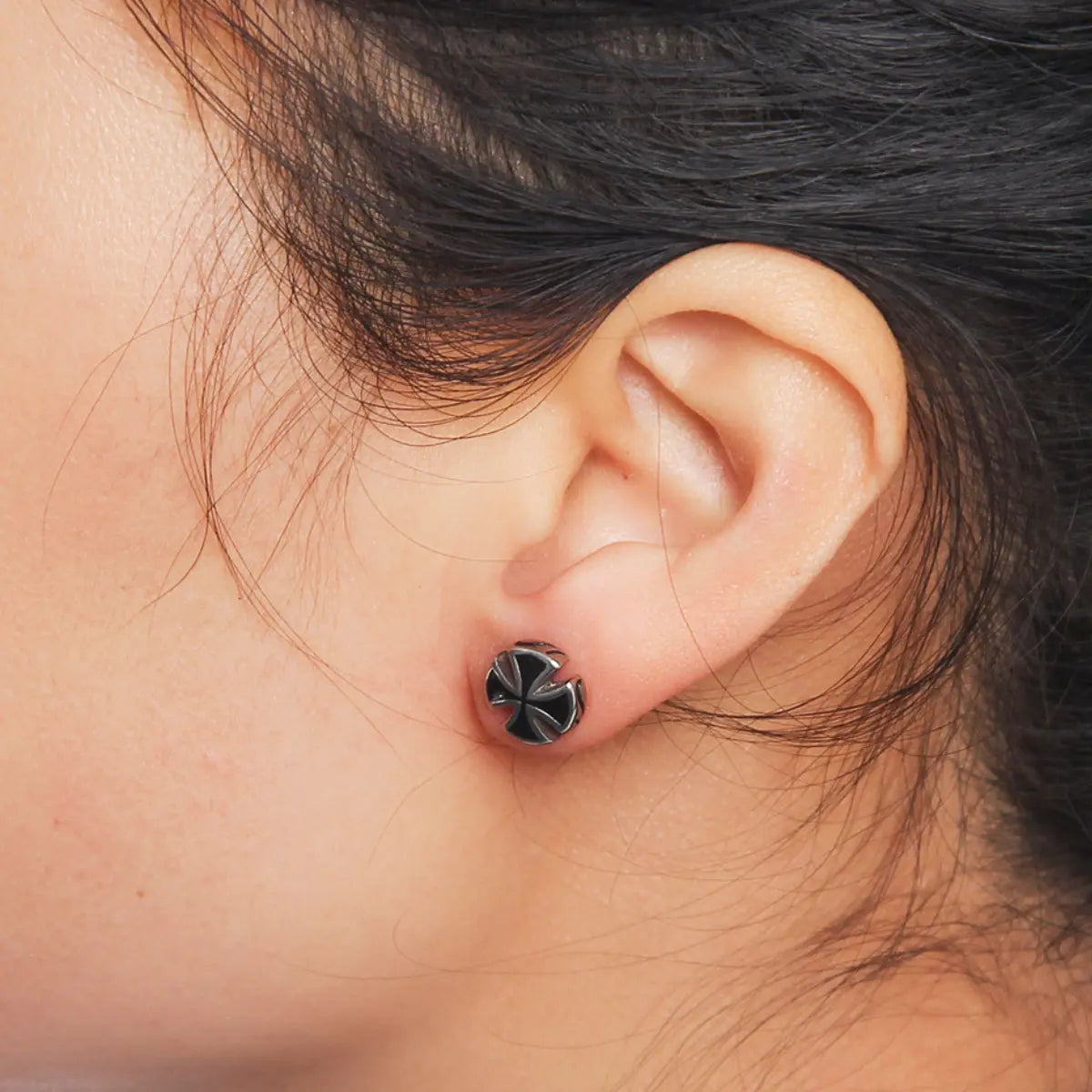 Round Iron Cross Stud Earrings Worn by Female Model Close Up