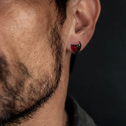 Ruby Heart Skeleton Hand Stud Earrings Worn by Male Model Close Up