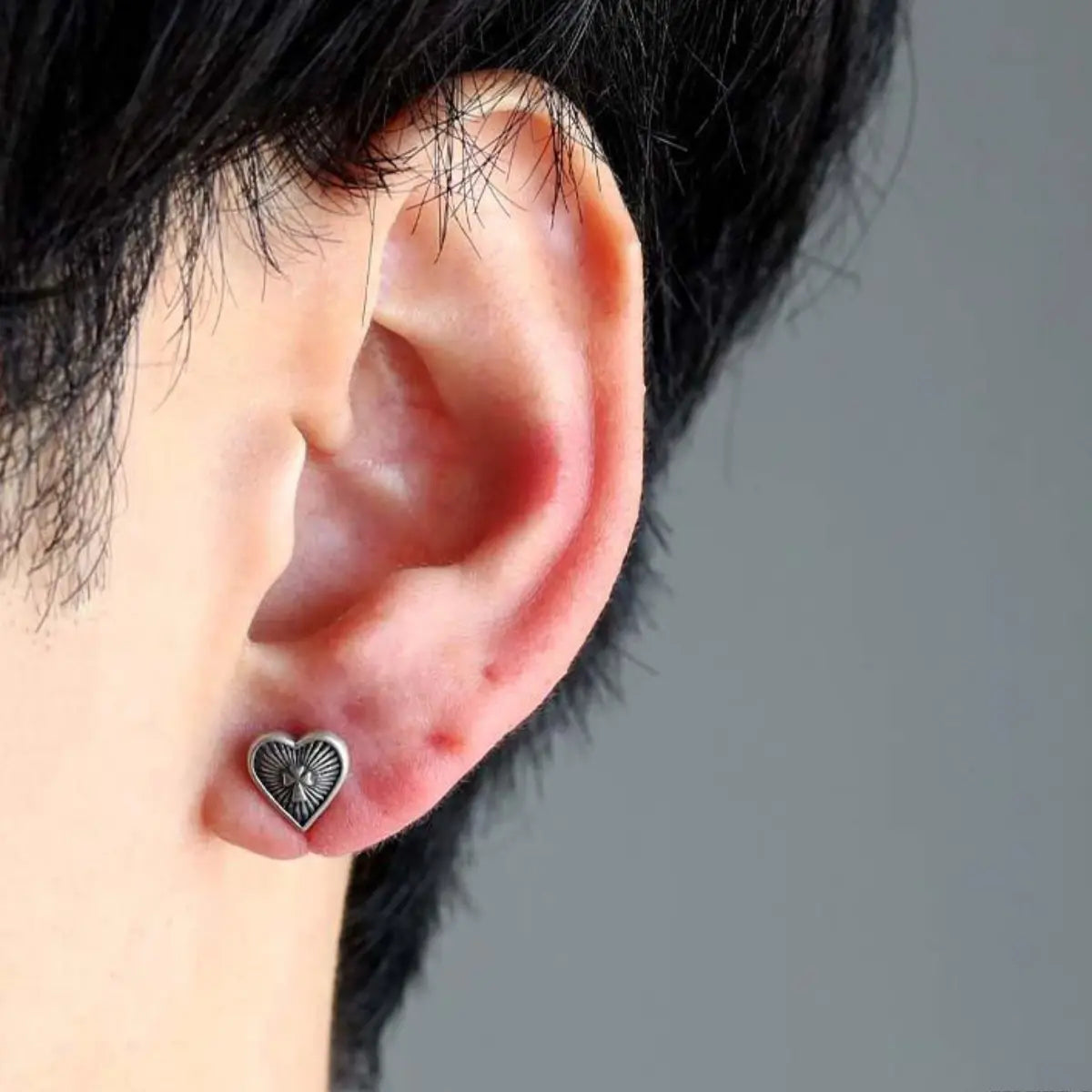 Sacred Heart Earrings Worn by Male Model Close Up