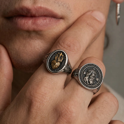 Sacred Heart Ring Worn with Crown of Thorns Ring on Male Hand