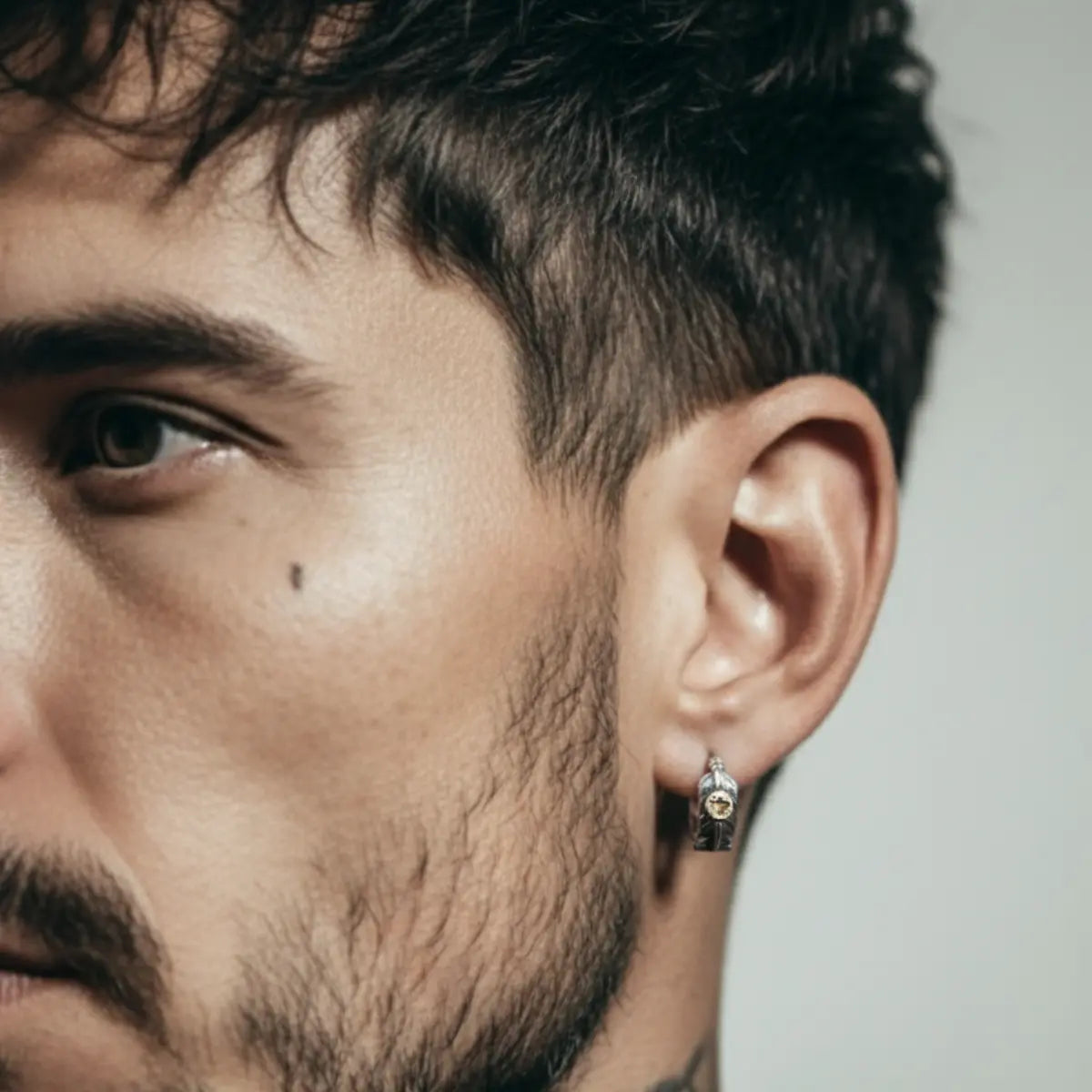 Silver Feather Huggie Hoop Earrings Worn by Male Model