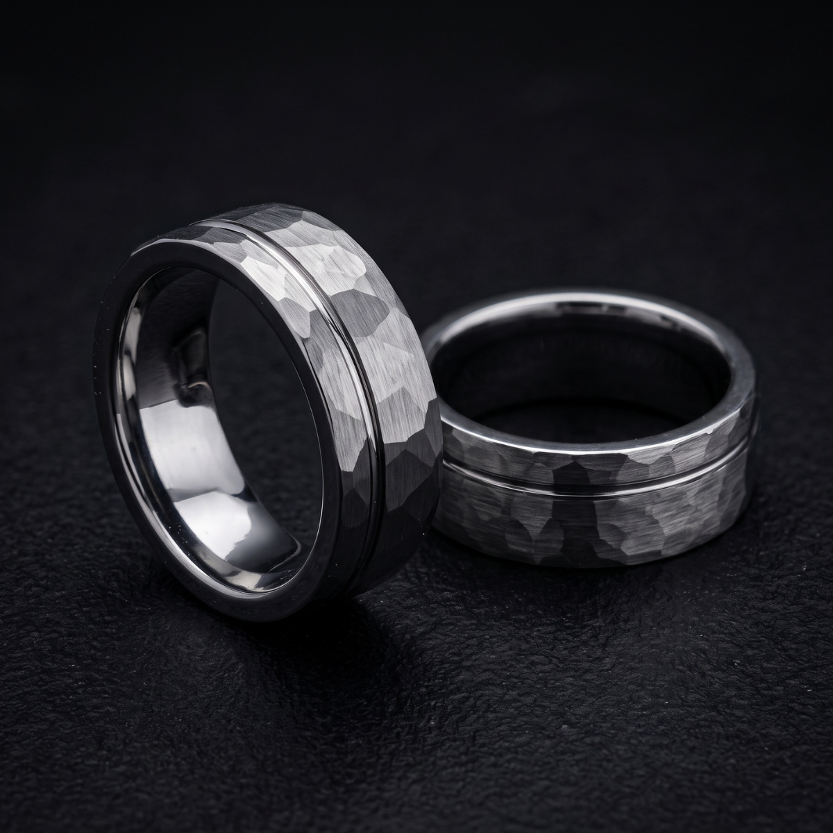 Silver Hammered Tungsten Wedding Band Close Up Black Background