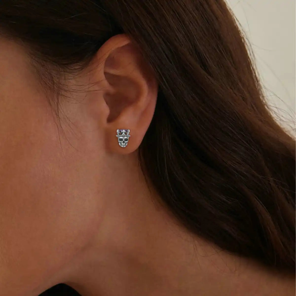 Silver King of Skull Stud Earrings Worn by Female Model