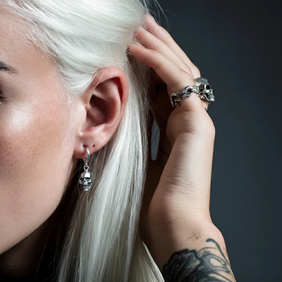 Silver Skull Head Hoop Earrings Worn by Female Model Close Up