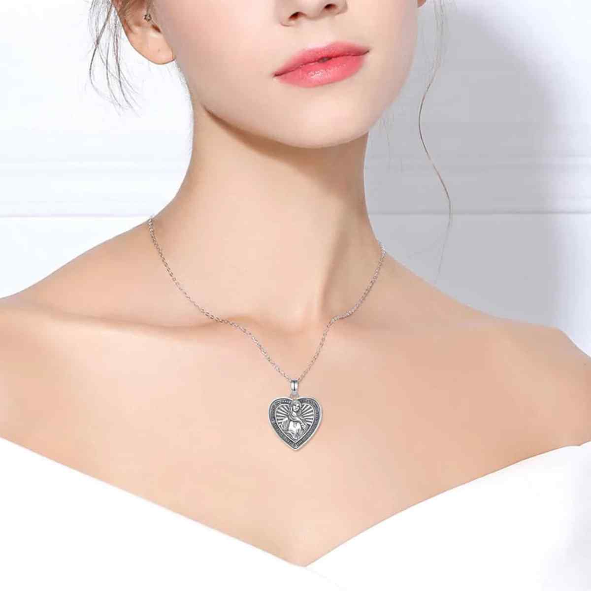 Silver Virgin Mary Heart Shaped Pendant Necklace Worn by Model Xenos Jewelry