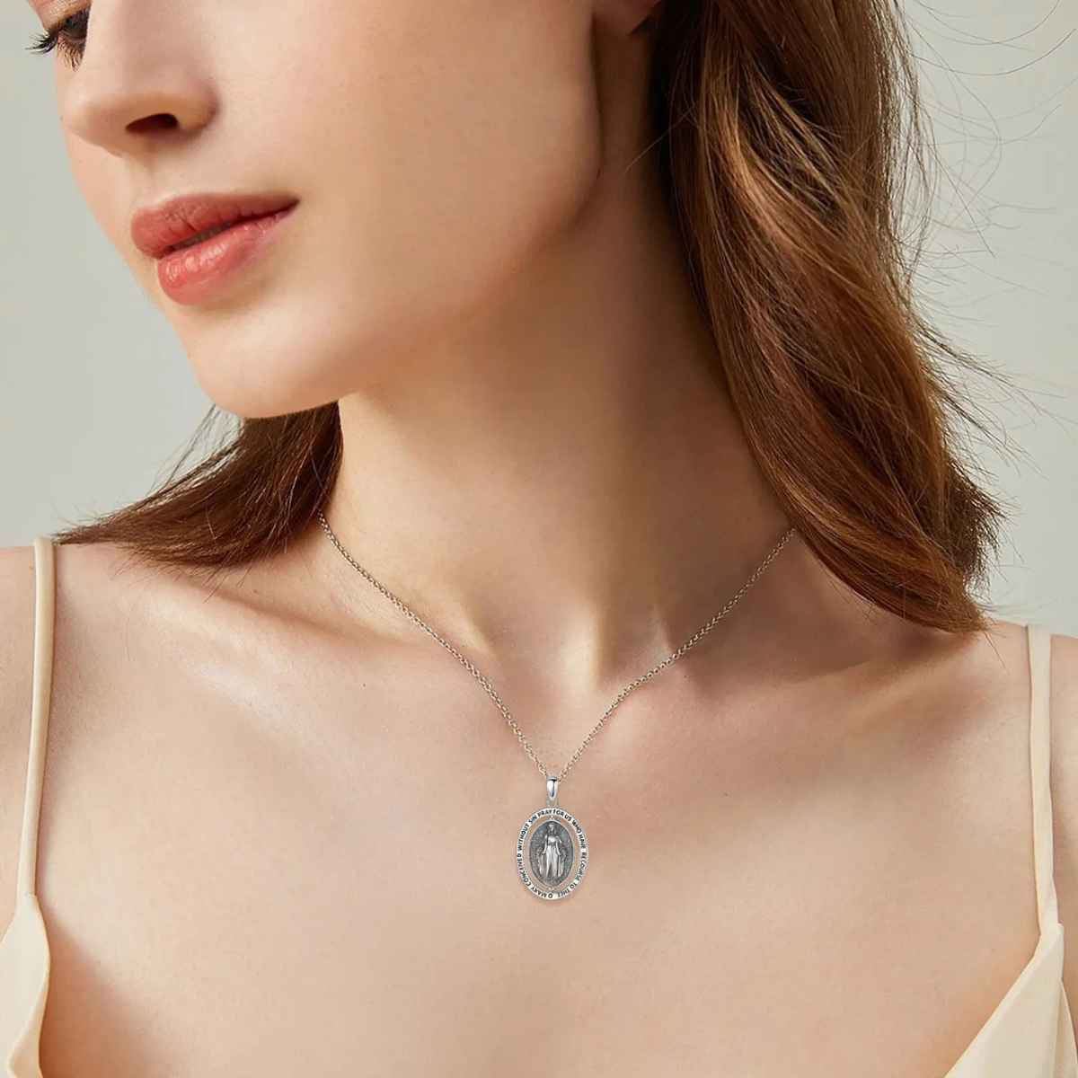 Silver Virgin Mary Necklace with Inscription Worn by Model Xenos Jewelry