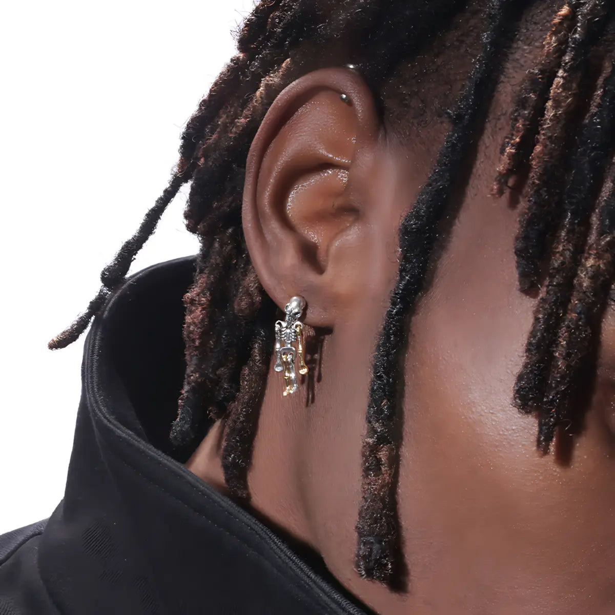 Skeleton dangle earrings sterling silver worn by male model side view