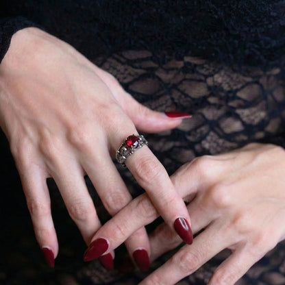 Skeleton Engagement Ring Red Stone Worn by Female Model