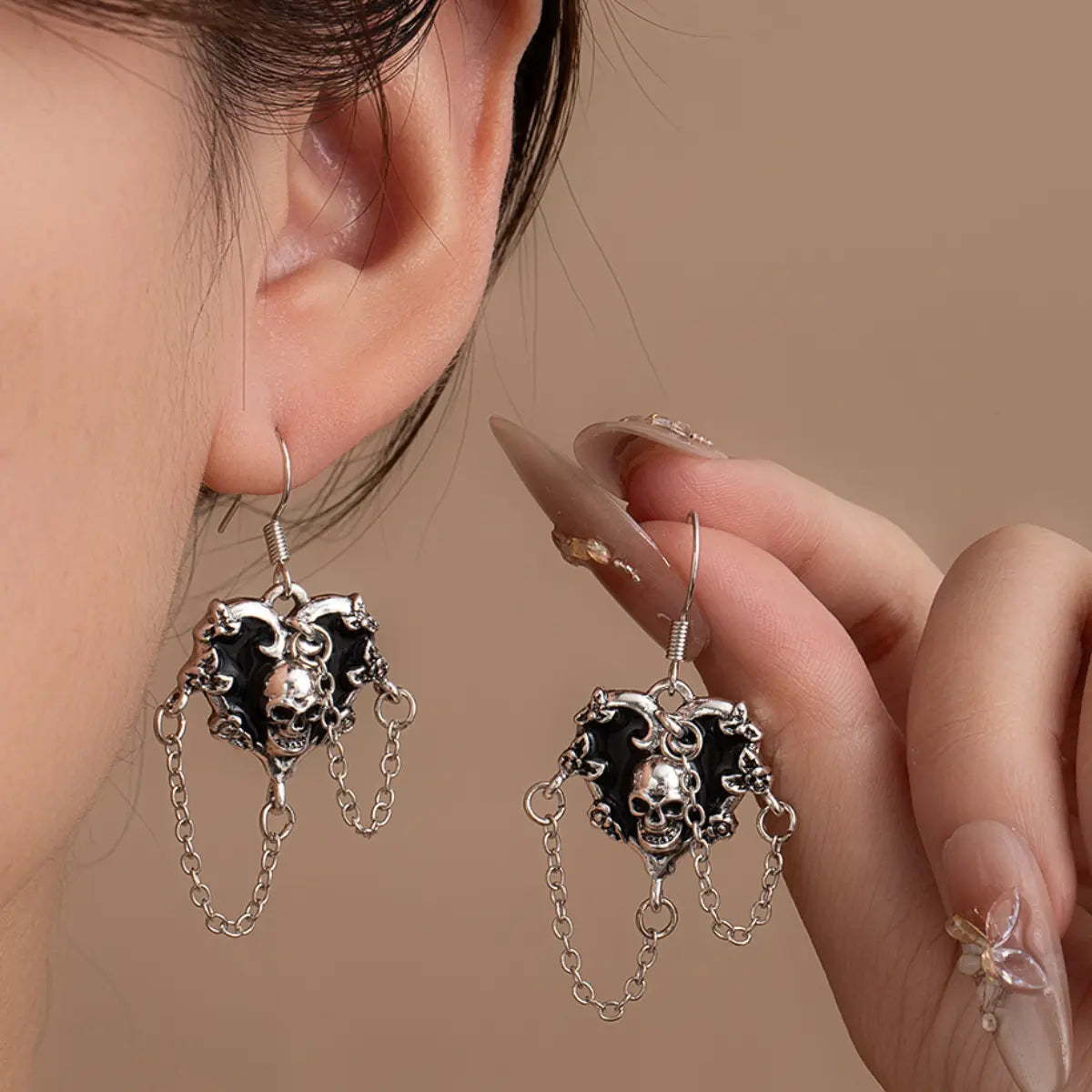 Skull Chain Drop Earrings Worn by Female Model
