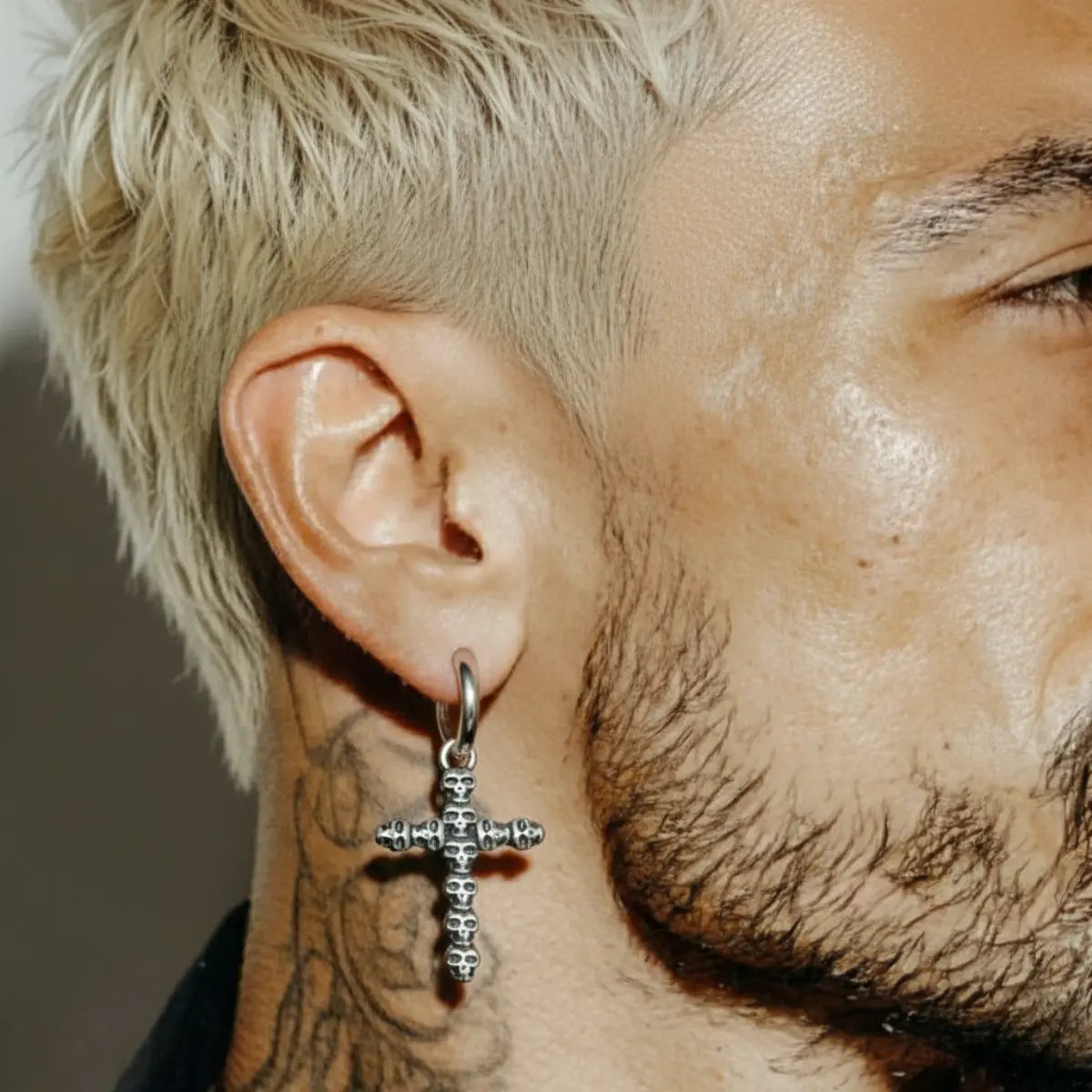 Skull Cross Dangle Hoop Earrings Worn by Male Model