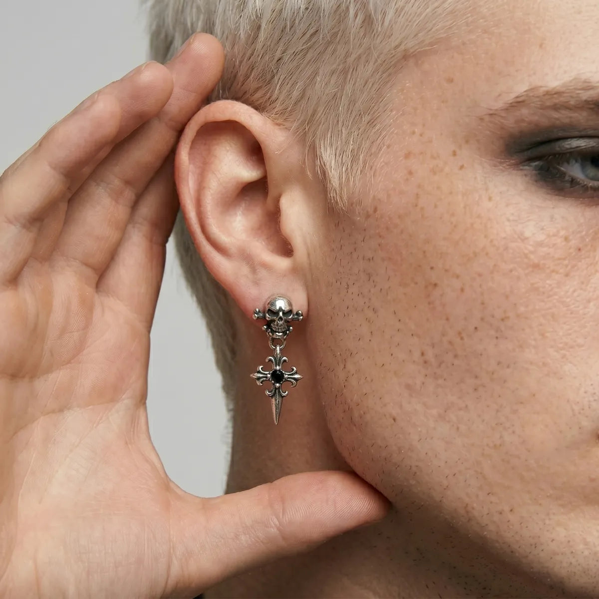 Skull Cross Drop Stud Earrings Black CZ Worn by Male Model Side View