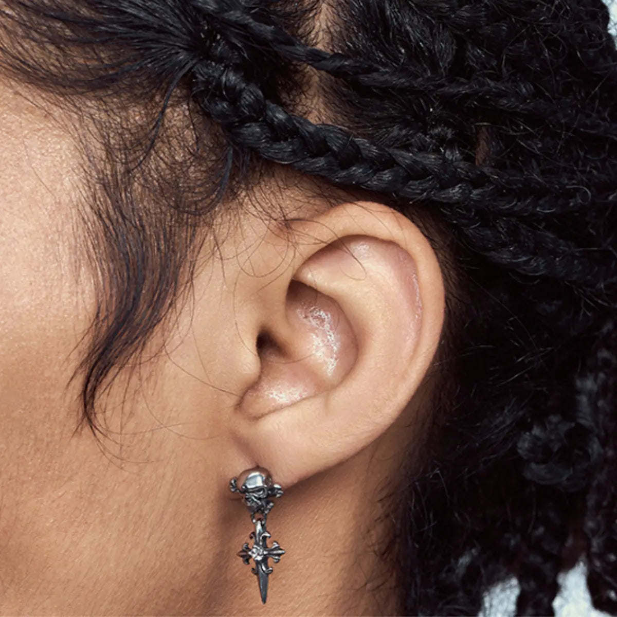 Skull Cross Drop Stud Earrings White CZ Worn by Male Model