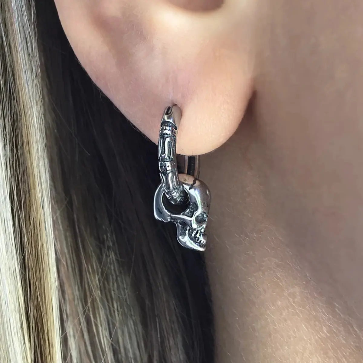 Skull Dangle Hoop Earrings Worn by Female Model Close Up