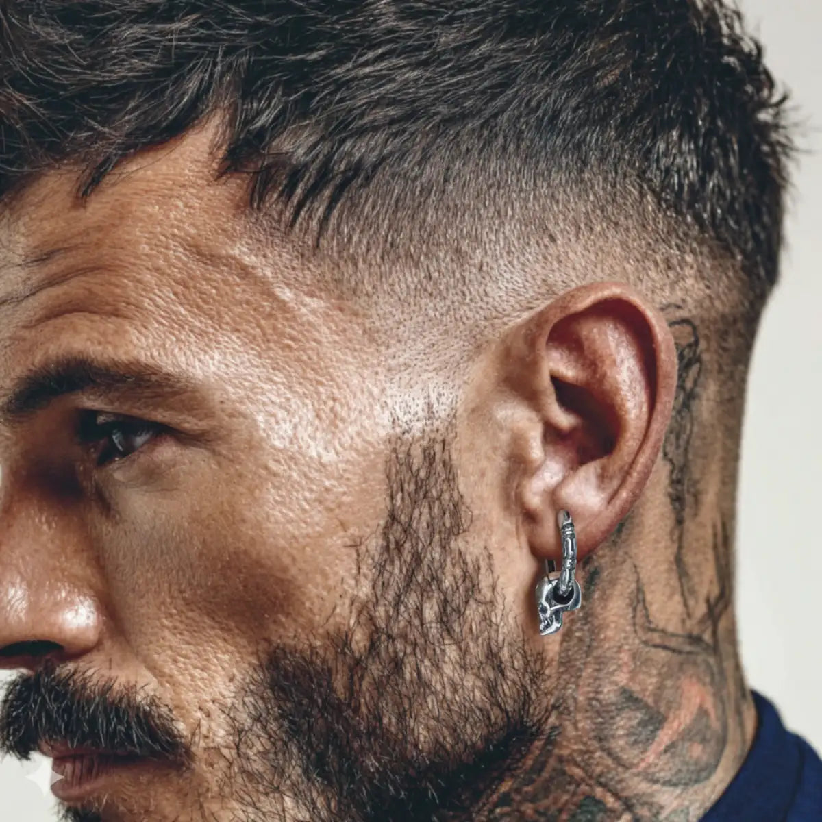 Skull Dangle Hoop Earrings Worn by Male Model