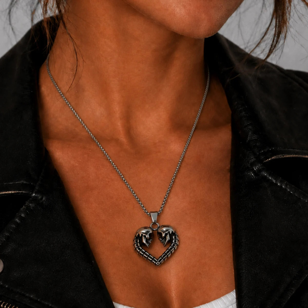 Skull Heart Necklace Silver Worn by Female Model Chest View