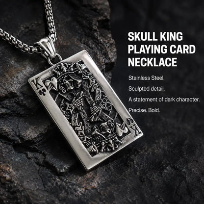 Skull King Playing Card Pendant Necklace Silver Displayed on Stone Surface