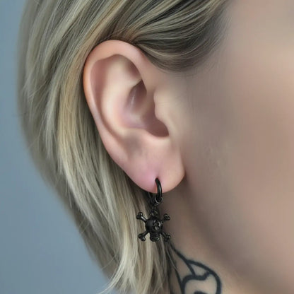 Skull and Crossbones Dangle Hoop Earrings Black Worn by Female Model