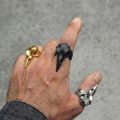 Sleek Raven Skull Rings Gold Silver and Black Worn by Male Model