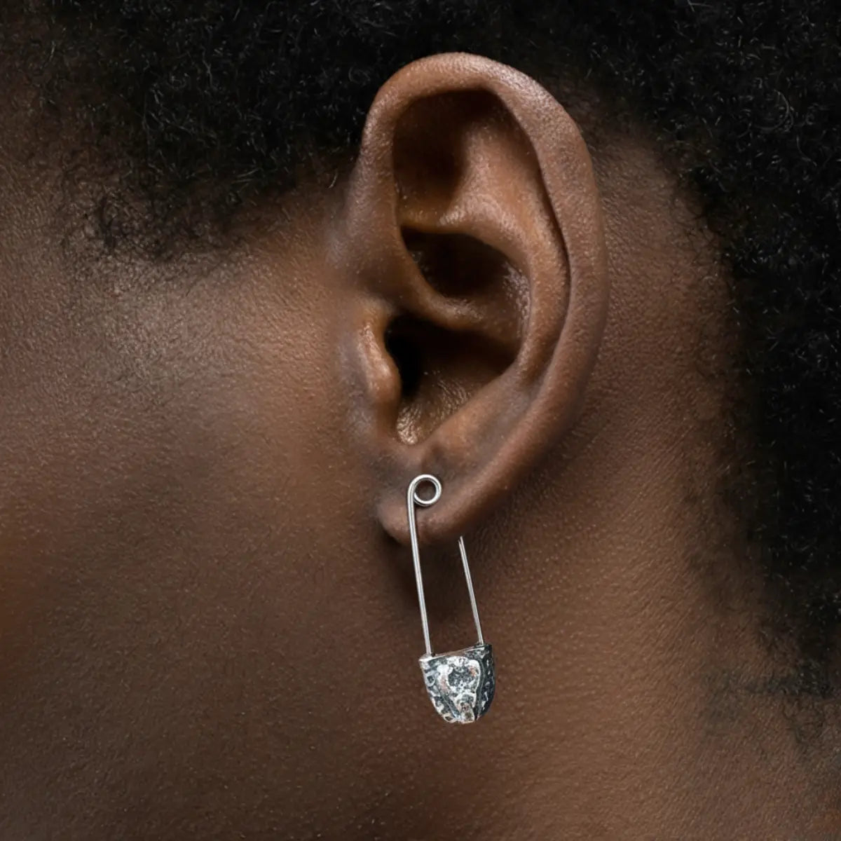 Snake Head Safety Pin Earrings Worn by Male Model