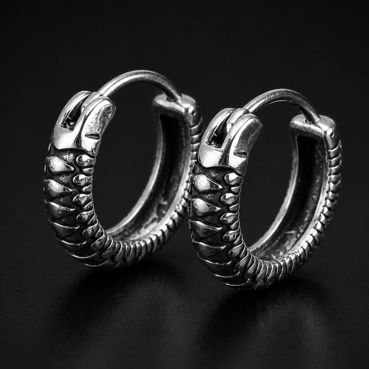 Snake Skin Hoop Earrings Silver Pair Close Up Black Background