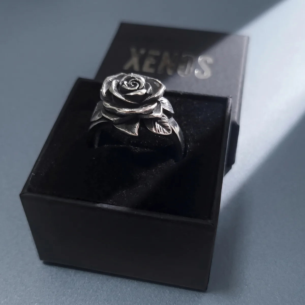 Solid Rose Ring Silver Presented in Xenos Jewelry Packaging Box