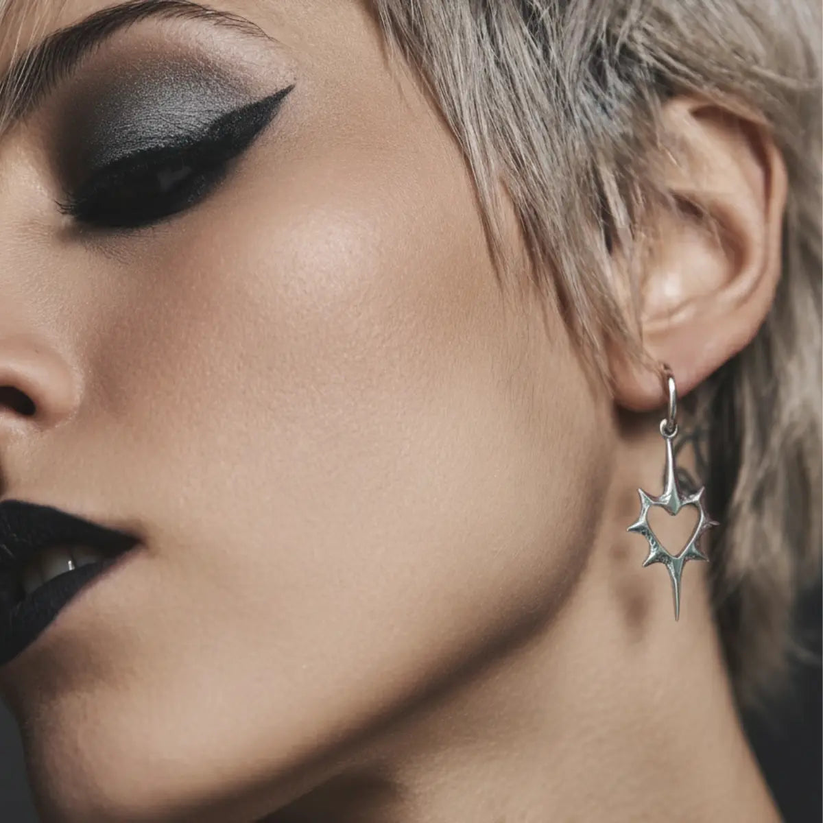 Spike Heart Drop Hoop Earrings Worn by Female Model