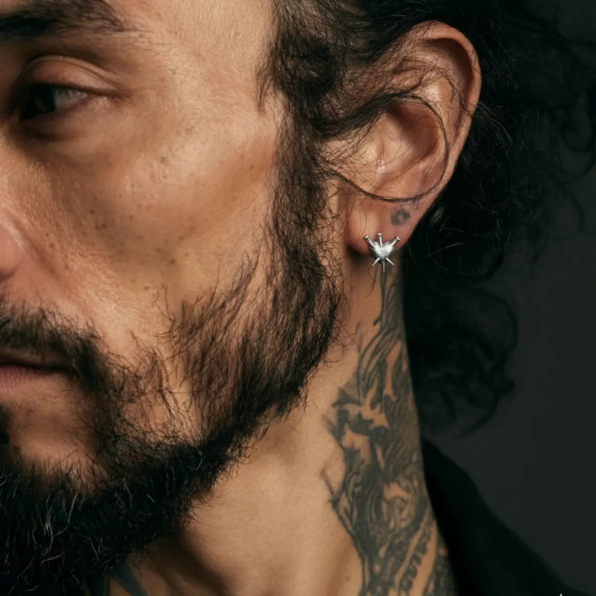 Spike Nailed Heart Stud Earrings Worn by Male Model