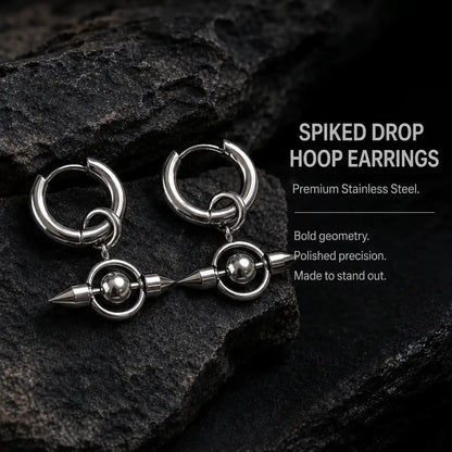 Spike Orb Drop Earrings Silver Pair Displayed on Leather Surface