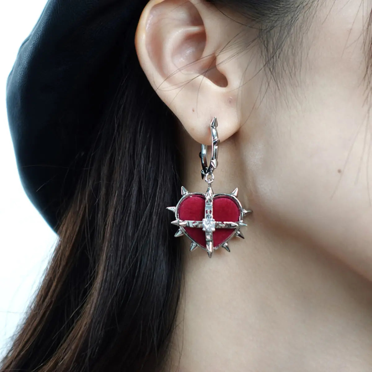 Spiked Heart Earrings Red Velvet Worn by Female Model Close up

