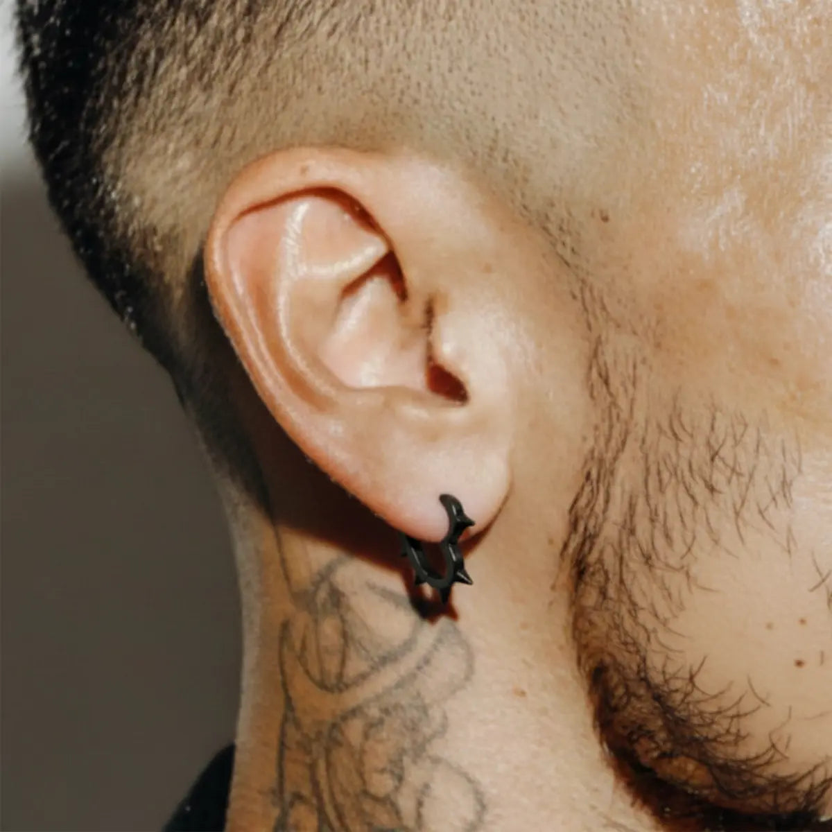 Spiked Heart Hoop Earrings Black Worn by Male Model