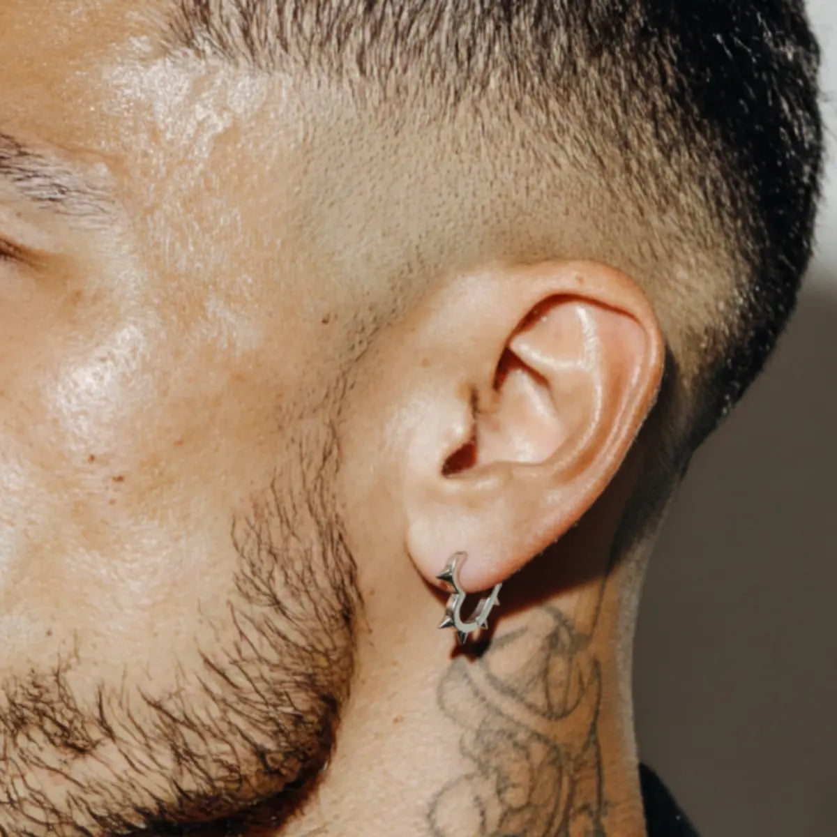 Spiked Heart Hoop Earrings Silver Worn by Male Model