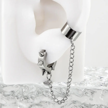 Spiked Hoop Earrings and Ear Cuff Silver Worn on White Ear Close up
