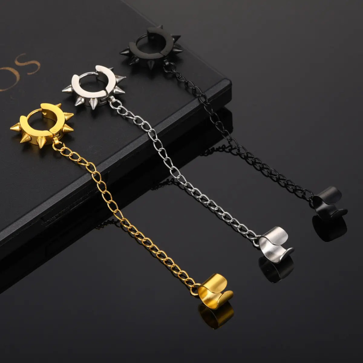 Spiked Hoop Earrings and Ear Cuff Set in Three Colors Gold Silver Black on Black Background
