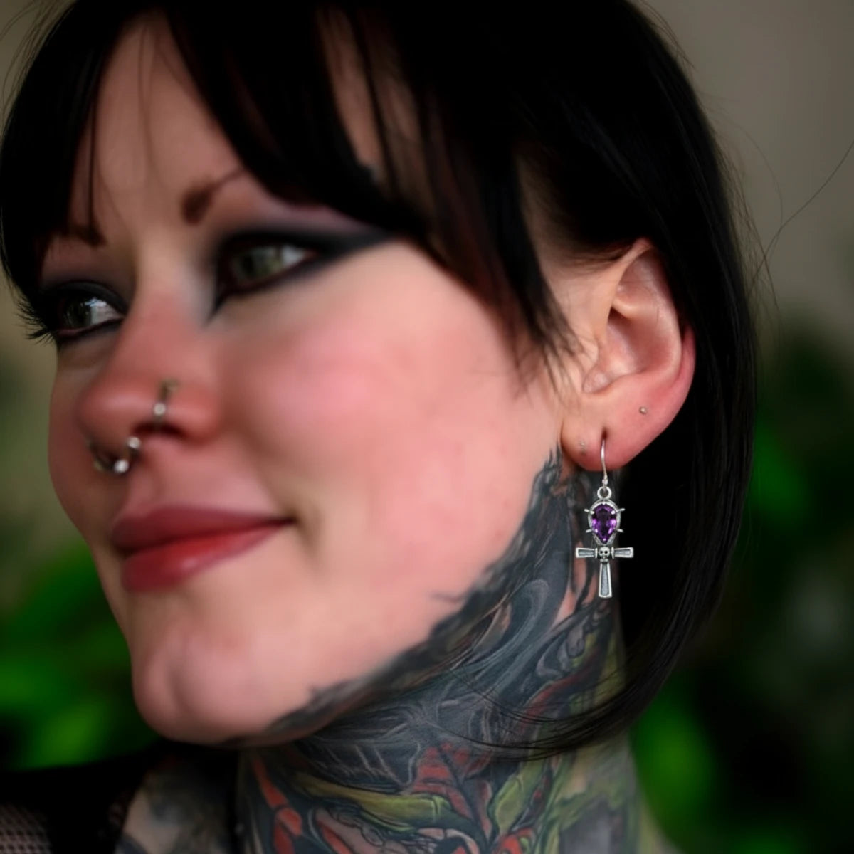 Spiked Purple Gem Ankh Dangle Earrings Worn by Female Model