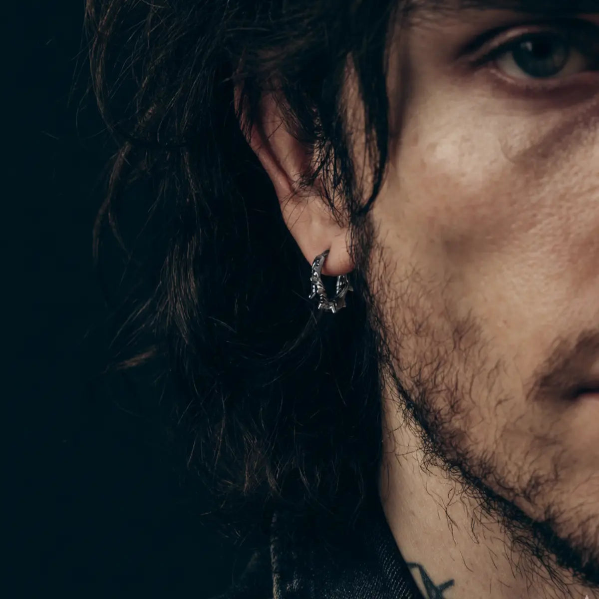 Spiked Thorn Huggie Hoop Earrings Worn by Male Model Front