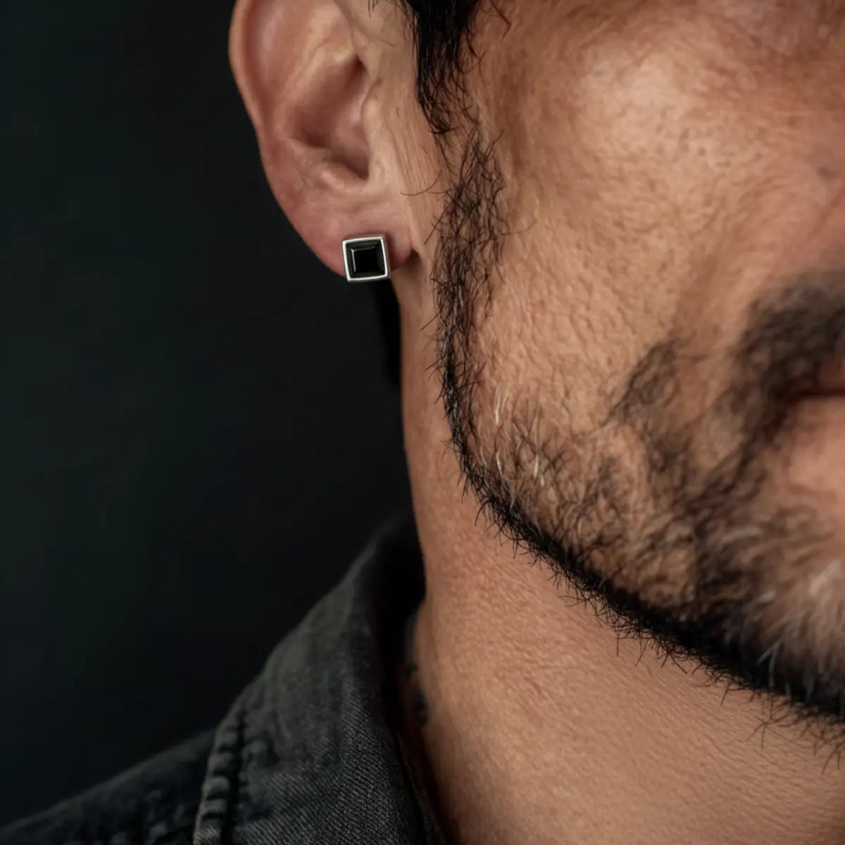 Square Black Diamond Stud Earrings Worn by Male Model Front