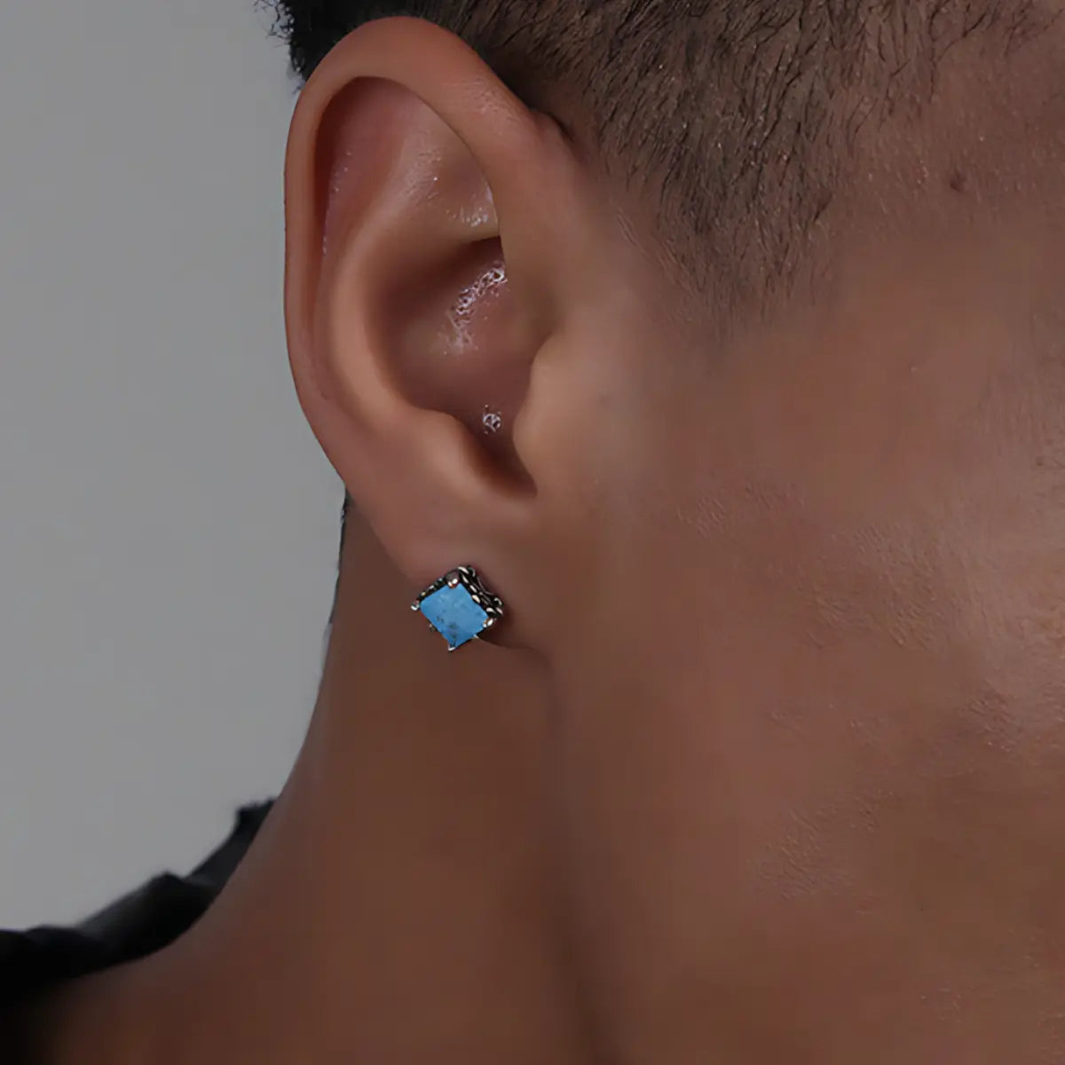 Square Cut Blue Stud Earrings Silver Worn by Male Model Close Up