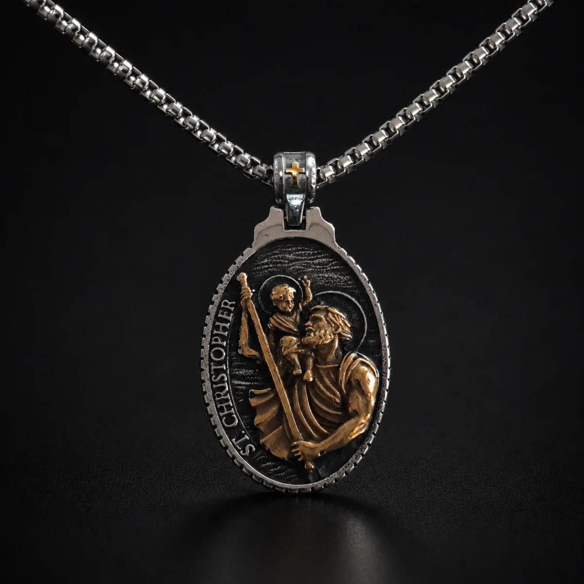 St Christopher Oval Pendant Necklace Gold and Silver Close Up Black Background